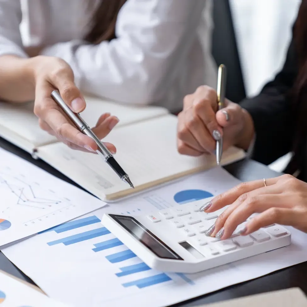 teamwork-process-two-business-women-calculating-a-2025-02-19-21-27-18-utc (1) (1)